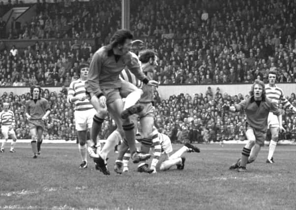 Dundee Uniteds George Fleming and Andy Gray take on the Celtic defence at Hampden. Picture: Allan Milligan