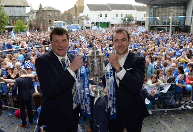 Club manager Tommy Wright (left) and captain Dave Mackay show off the Scottish Cup. Picture: SNS