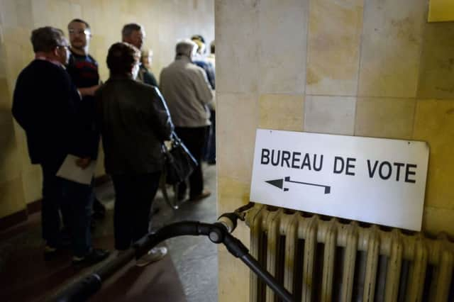 People queue to cast their ballot in Bulle, western Switzerland. Picture: Getty