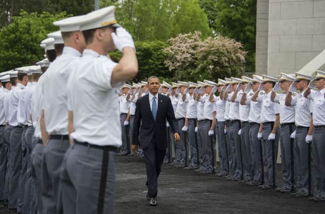 Cadets salute Barack Obama as he arrives at the United States Military Academy at West Point yesterday. Picture: AFP/Getty Images