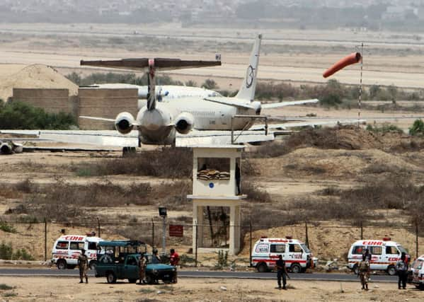 Security forces stand guard at Karachis international airport yesterday. Picture: AP