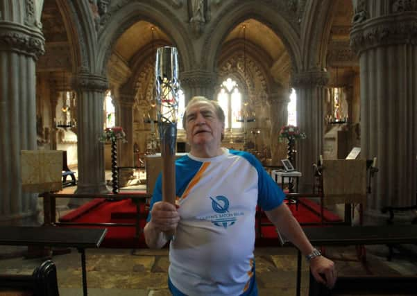 Actor Brian Cox carrying the Queen's Baton at Rosslyn Chapel, Midlothian. Picture: PA