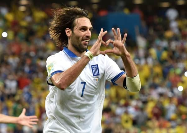 Young Celtic fan Jay Beattie has had to turn down the chance to see Georgios Samaras and his Greek team-mates at the World Cup. Picture: Getty