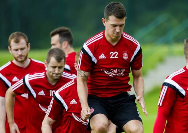 Aberdeens Ryan Jack has a spring in his step during pre-season training yesterday. Picture: SNS