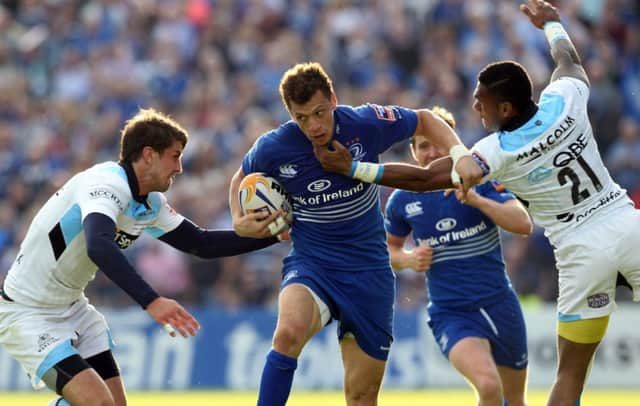 Peter Murchie and Niko Matawalu, of Glasgow, try to stop Leinsters Zane Kirchner during last seasons final. Picture: Getty