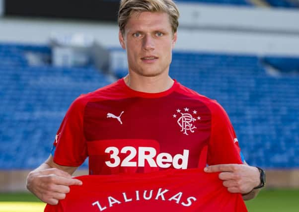 Marius Zaliukas captained Hearts to their greatest moment in thrashing Hibs 5-1 in the 2012 Scottish Cup final, but he and Ian Black, below, are likely to play against the Jambos for Rangers.