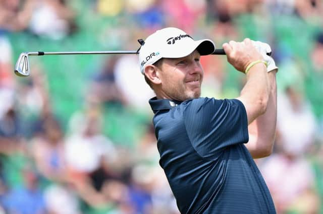 Stephen Gallacher tees off at the fourth yesterday on his way to a 68 and a 15th-place finish in The Open. Picture: Warren Little