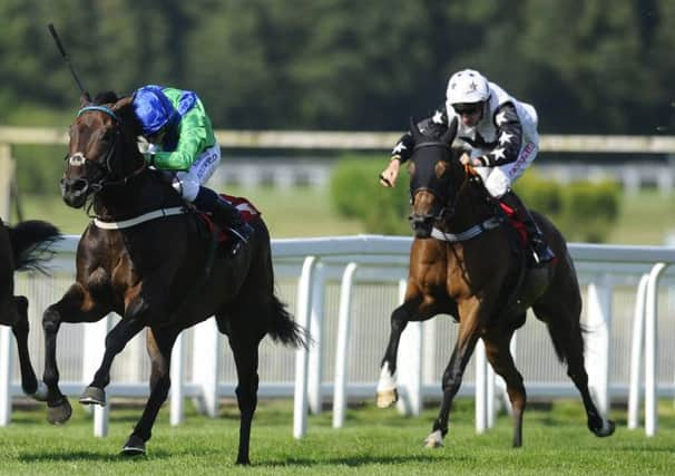 Jockey championship leader Ryan Moore completes his fourtimer on Global Leader, left, at Sandown Park. Picture: Alan Crowhurst/Getty