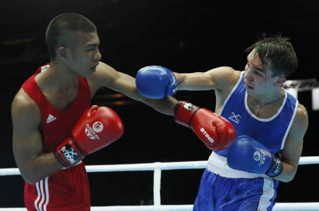 Michael Conlan of Northern Ireland, left, fights Matthew Martin from Nauru. Picture: AP