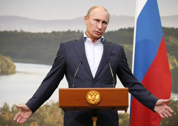 Putin holds court at the G8 summit in Enniskillen, Northern Ireland, last year. Picture: Getty