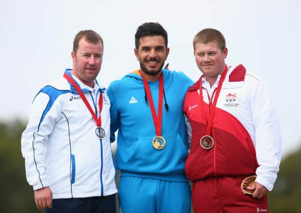 Drew Christie of Scotland, left, Georgios Achilleos, centre, and, Rory Warlow of England celebrate on the podium. Picture: Getty