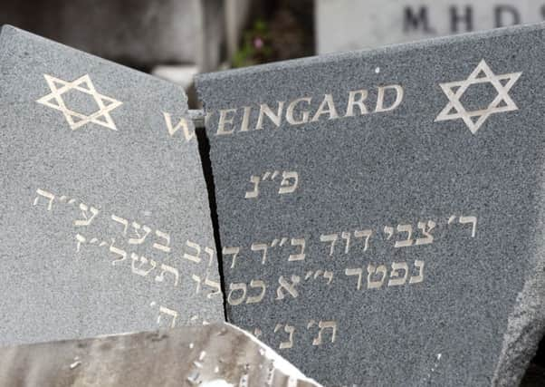 A damaged gravestone at a  cemetery in Manchester. Picture: SWNS