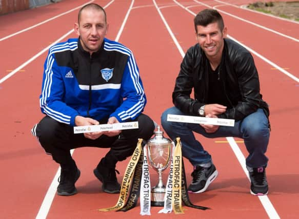 Peterhead's Graeme Smith (left) and Livingston's Mark Burchil. Picture: SNS