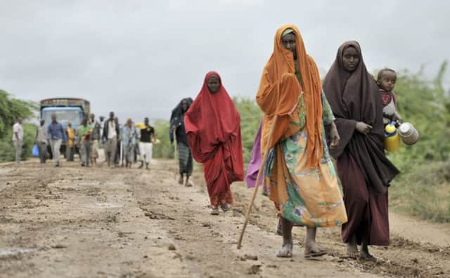 Civilians who'd left Bulomarer return following its capture. Picture:AP