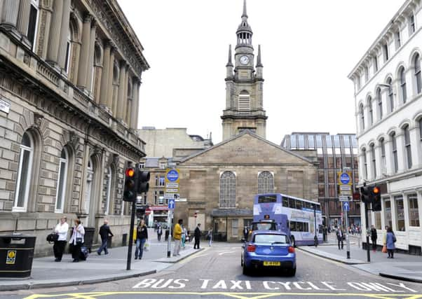 The bus gate at Nelson Mandela Place in Glasgow city centre has earned the council at least £800,000 in two months. Picture: John Devlin