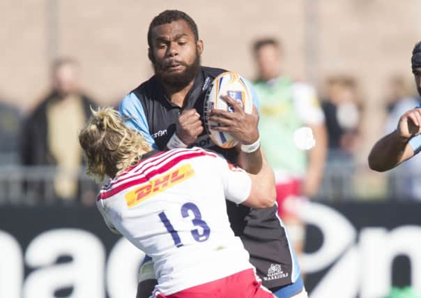 Glasgows Leone Nakawara is tackled by Harlequins Matt Hopper in preseason. Picture: SNS/SRU