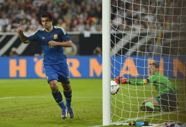 Sergio Aguero celebrates after scoring Argentinas opening goal. Picture: AP