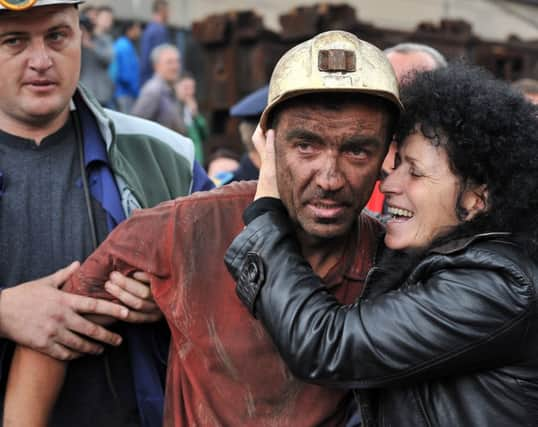 A survivor is greeted by a relative. Picture: Getty