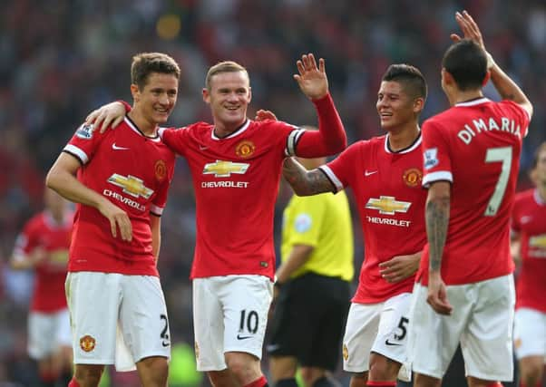 Wayne Rooney celebrates scoring Uniteds third goal with Ander Herrera, left, Marcos Rojo and Angel Di Maria. Picture: Getty