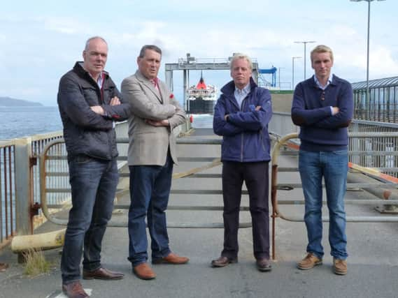 Mull Community Councils Calum macLachlainn, left, at the Craignure terminal with local businessmen. Picture: Moira Kerr