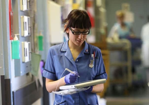 This nurse could be joined by 20,000 more under Ed Milibands plans for more spending. Picture: Getty Images