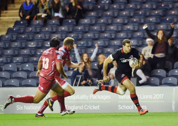 Tim Visser runs in to score his sides first try during last nights draw with Scarlets at Murrayfield.  Picture: SNS