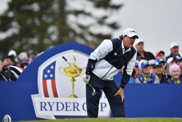 Phil Mickelson nervously watches his tee shot on the ninth. Picture: Getty