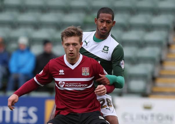 Jamie Reckord (back) playing for Plymouth in 2013. Picture: Getty