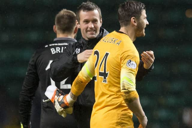 Ronny Deila congratulates goalkeeper Lukasz Zaluska on his performance. Picture: SNS