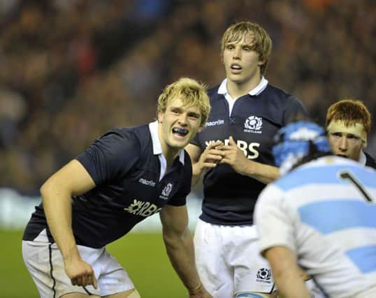 Playing together for the first time in a competitive match, Richie and Jonny Gray prepare for a line-out. Picture: Ian Rutherford