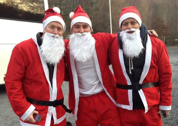 Derek McEwan (centre) with pals Gary Conway (left) and Ross Watson. Picture: PA