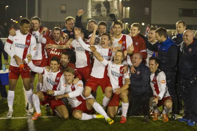 The Spartans squad celebrate a famous Scottish Cup victory. Picture: Steven Scott Taylor