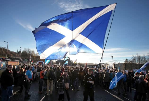 Protesters gather at Faslane yesterday, to call for the scrapping of the nuclear deterrent. Picture: SWNS