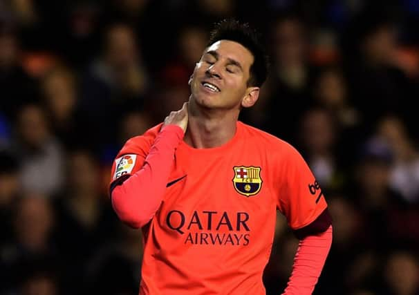 Barcelonas Lionel Messi was struck by a bottle thrown from the crowd in Valencias Mestalla Stadium on Sunday. Picture: Getty