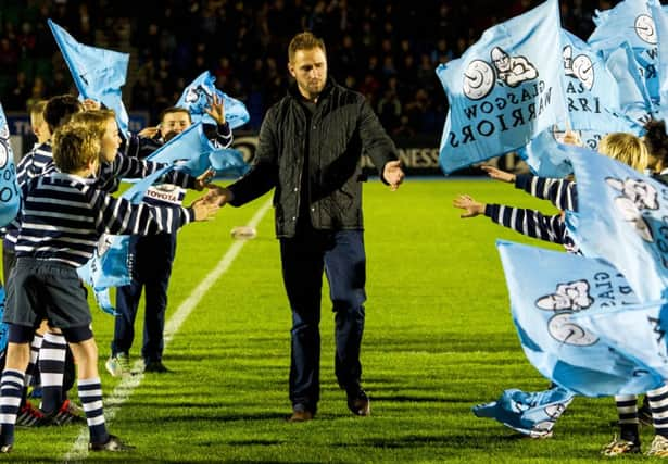 Dan Parks receives the adulation of Glasgow Warriors youngsters when he visits his old pro team. Picture: SNS