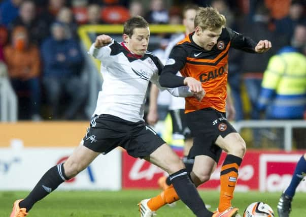 Aberdeen's Peter Pawlett (left) battles with Stuart Armstrong. Picture: SNS