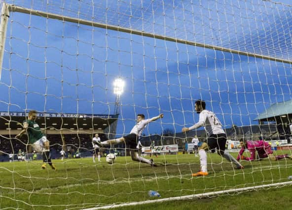 Hibs Jason Cummings scores from close range at Starks Park, to level the the scores in his sides 3-1 victory. Picture: SNS