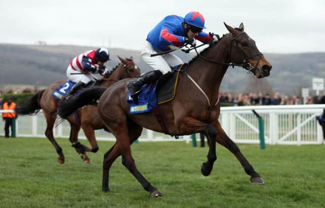 Splash of Ginge, ridden by Jamie Bargary, on the way to victory in the BetBright Best for Festival Betting Handicap Chase. Picture: PA