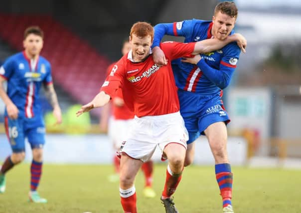 ICT's Marley Watkins battles with Scott Boyd. Picture: SNS