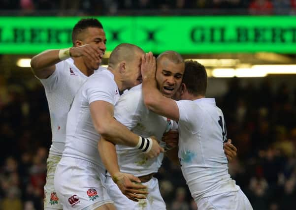 England's centre Jonathan Joseph (C) celebrates with team-mates. Picture: AFP