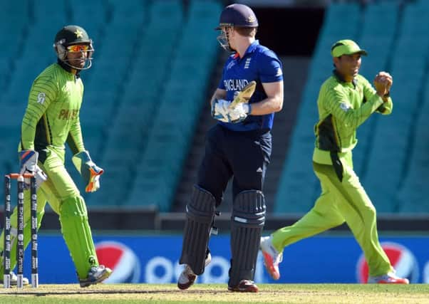 Eoin Morgan looks around as he is caught by Pakistans Younis Khan for a duck in Sydney. Picture: AFP/Getty