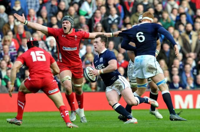 Stuart Hogg makes a break during yesterdays 26-23 defeat by Wales. Picture: Ian Rutherford