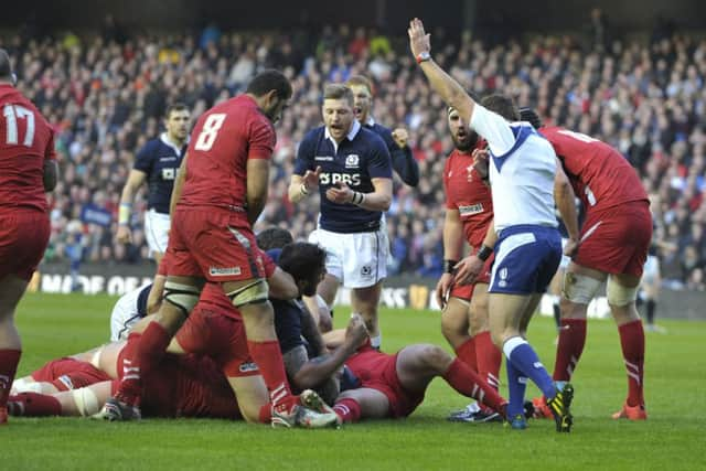 Jim Hamilton and Finn Russell celebrate as the referee signals a try. Picture: Ian Rutherford