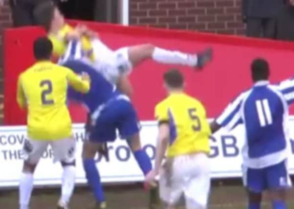 Ouch: Shabir Khan bodyslams Charlie Russell. Picture: YouTube