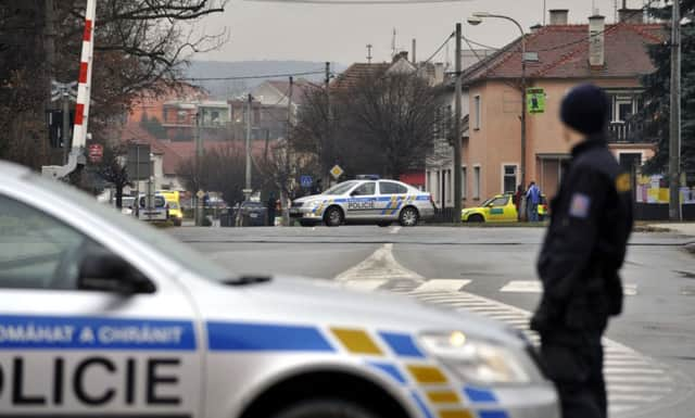 A police officer patrols near the restaurant. Picture: AP