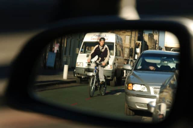 Bicycles and cars are often like cats and dogs on the roads. Picture: Phil Wilkinson