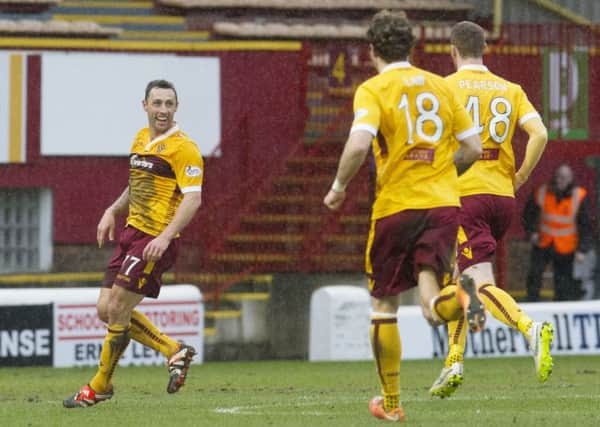 Scott McDonald (left) celebrates after netting the equaliser. Picture: SNS