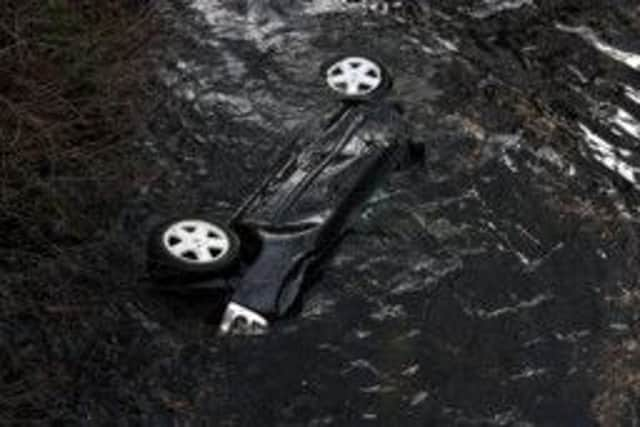 The car submerged in water in Loch Ness. Picture: RNLI