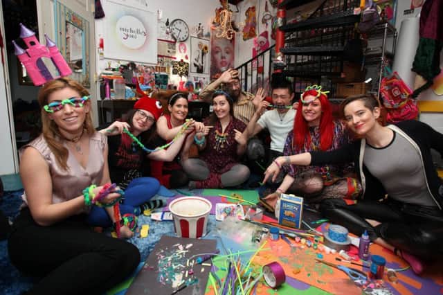 'Students' of the adult preschool take part in making pasta jewellery. Picture: Ruaridh Connellan / Barcroft USA