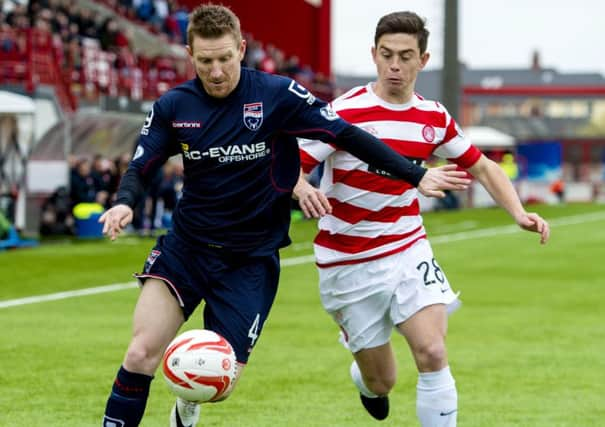 Ross County's Michael Gardyne (left) holds off Hamilton's Danny Redmond. Picture: SNS